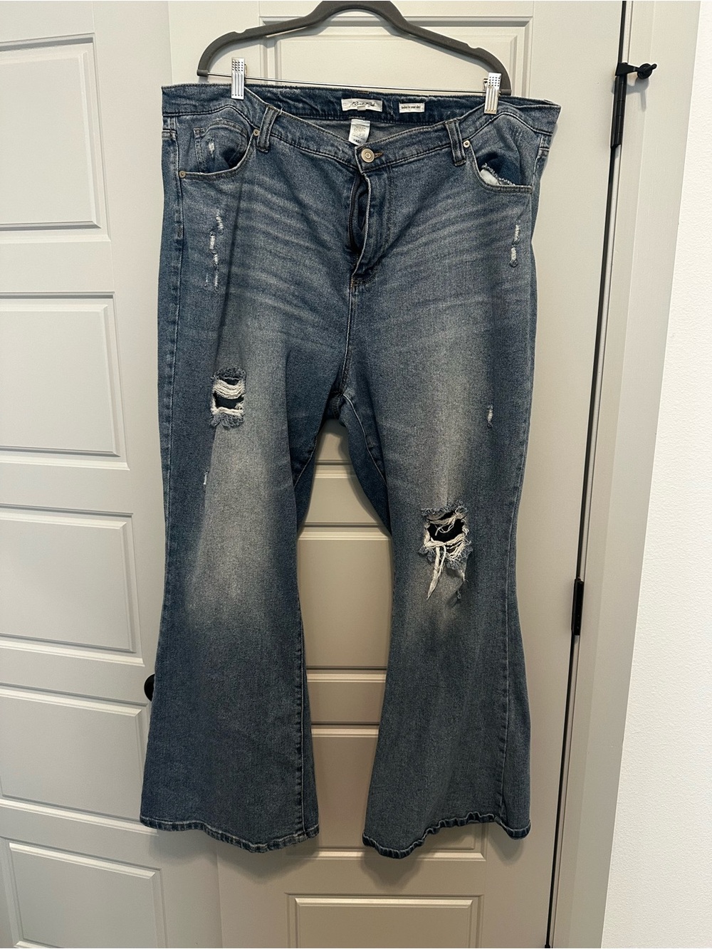 Distressed Women's Flare Jeans in Washed Denim